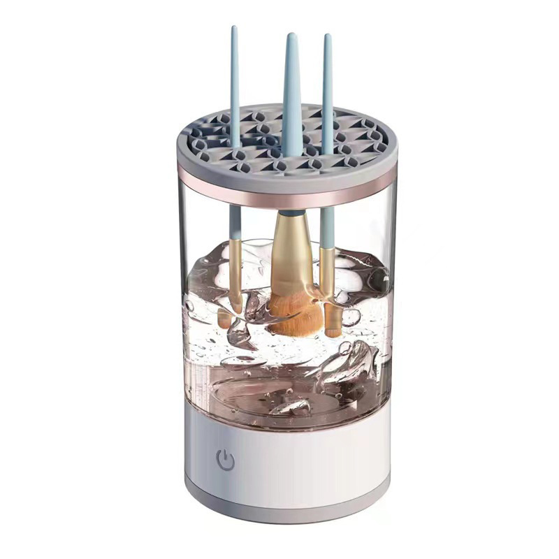 Clear cylindrical device with a gray top and base on a white background
