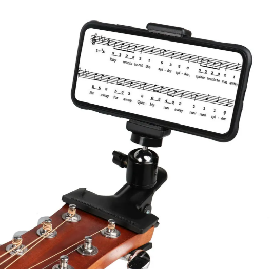 Phone holder with music sheet on a guitar headstock