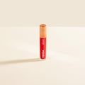 Red lipstick with 'Yensa' branding on a beige background