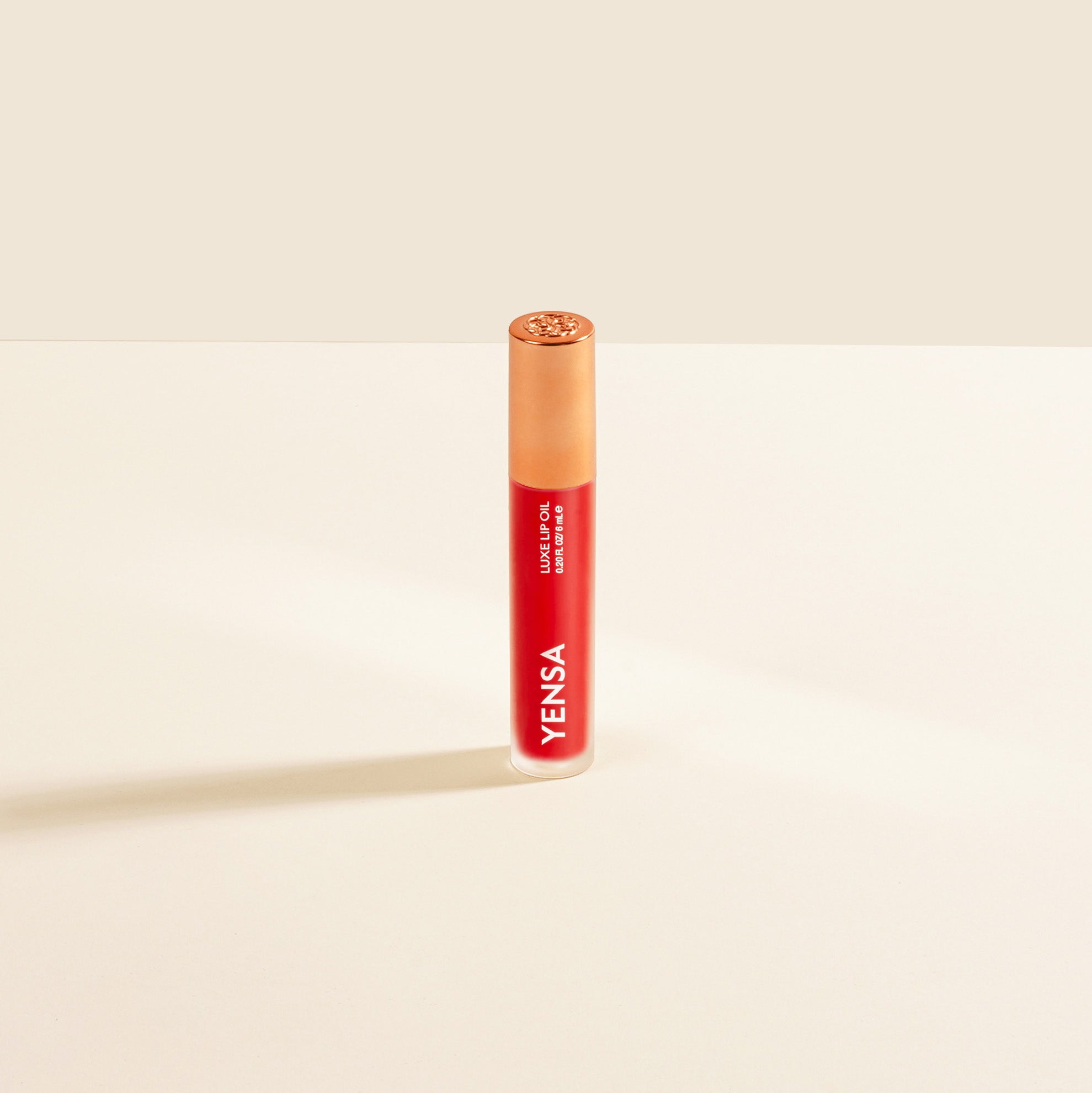 Red lipstick with 'Yensa' branding on a beige background
