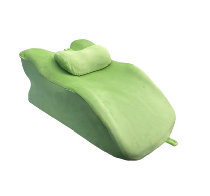 Green foam roller with a small green ball on a white background
