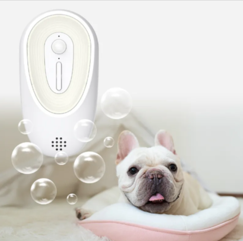 Dog in a bubble bath with a white device emitting bubbles